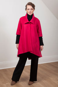 Woman wearing the Grace coat in red wool - front view