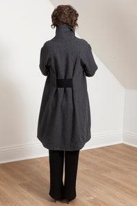 Woman wearing the Grace coat in grey wool - back view