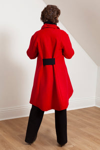 Woman wearing the Grace coat in red wool - back view